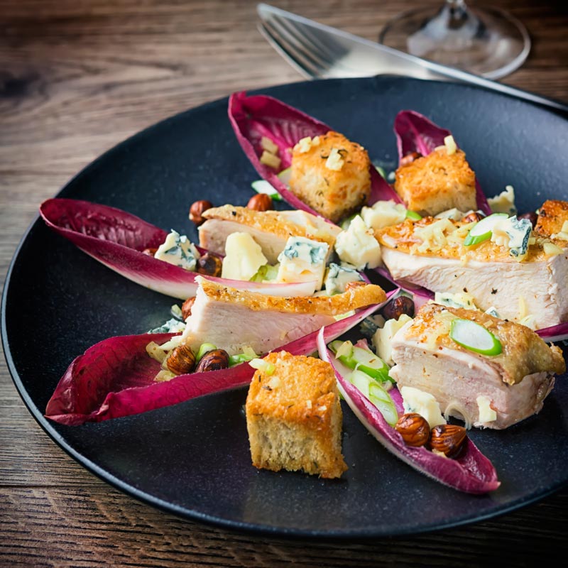 This Radicchio Salad is a perfect light winter main course salad, featuring Chicken, Hazelnuts and Blue Cheese it is loaded with the best winter produce.