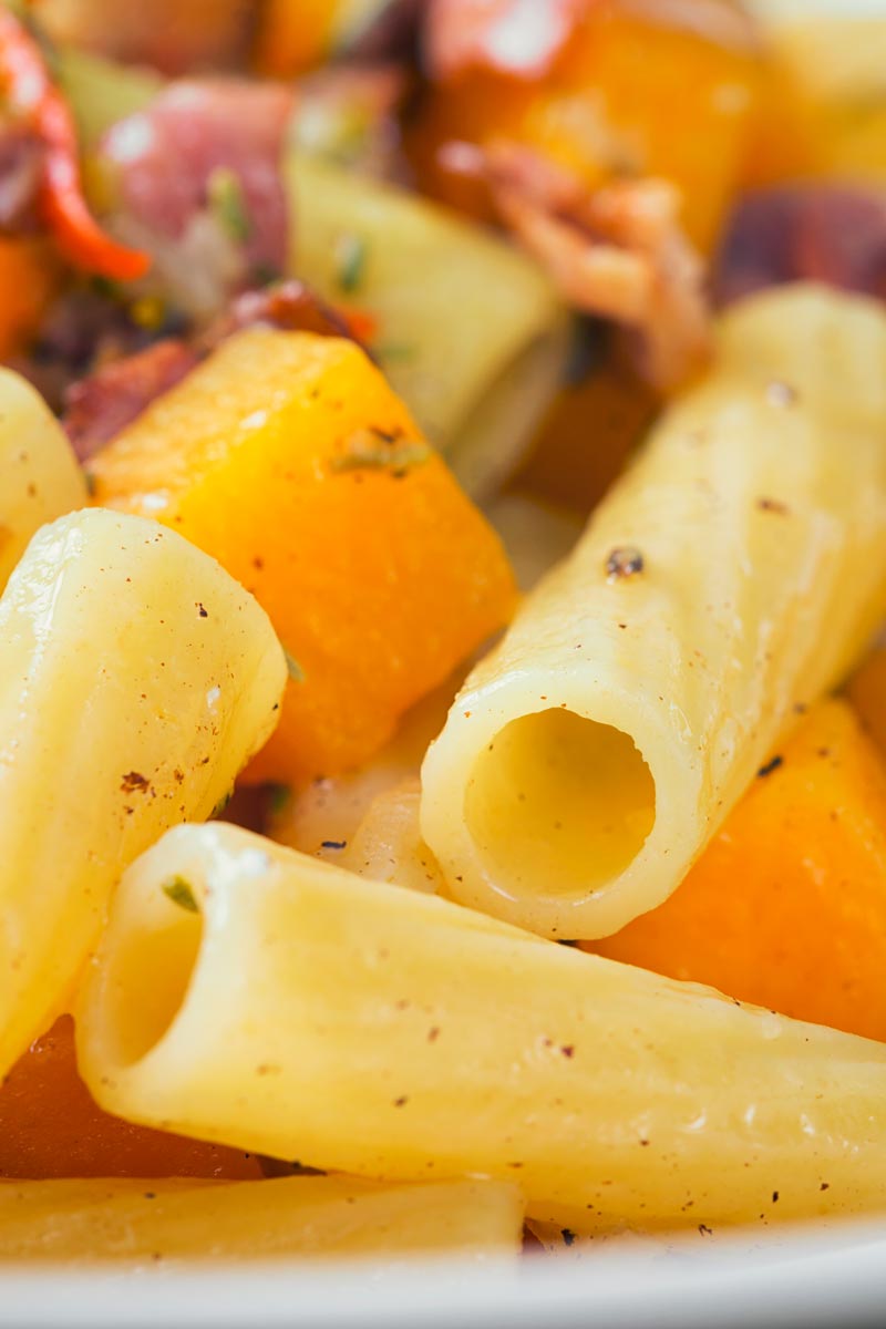 Close up image Butternut squash pasta (rigatoni) with bacon and chili