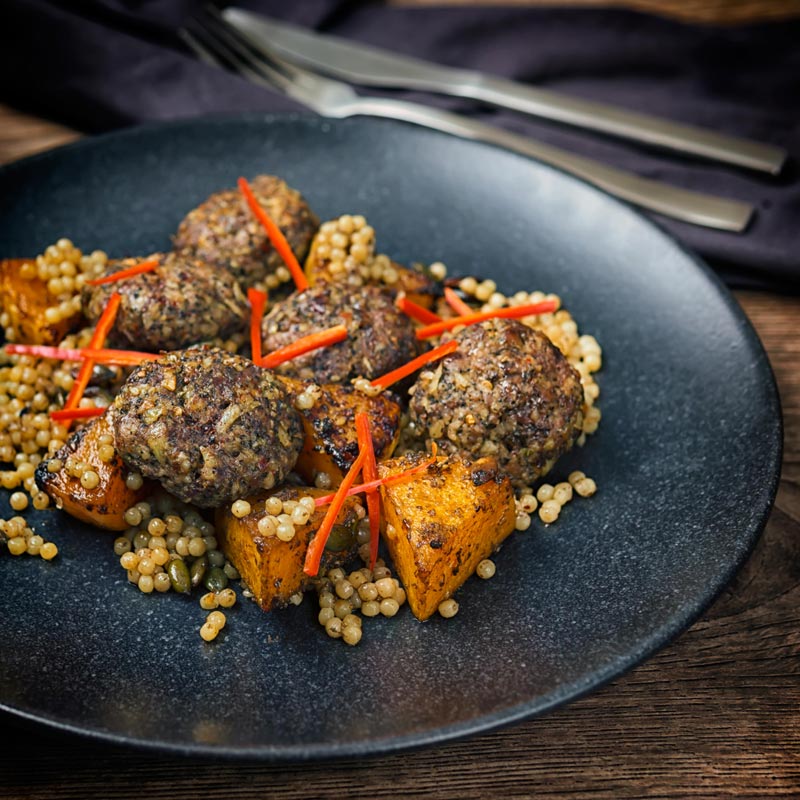 Square image of Lamb kofta, Israeli couscous and chili batons