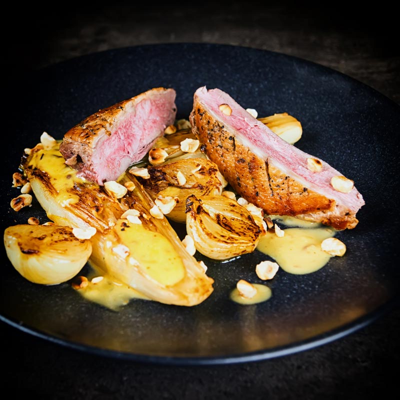 Endive may not be the first on the list of many peoples favourite vegetables, but it should be and it is perfect alongside this pan fried duck breast that utilises the cold pan method and is bundled a sexy anchovy sauce and it take less than an hour from start to finish. #endivesbraises #duckbreastrecipes #duckmaincourse #hazelnutsrecipes