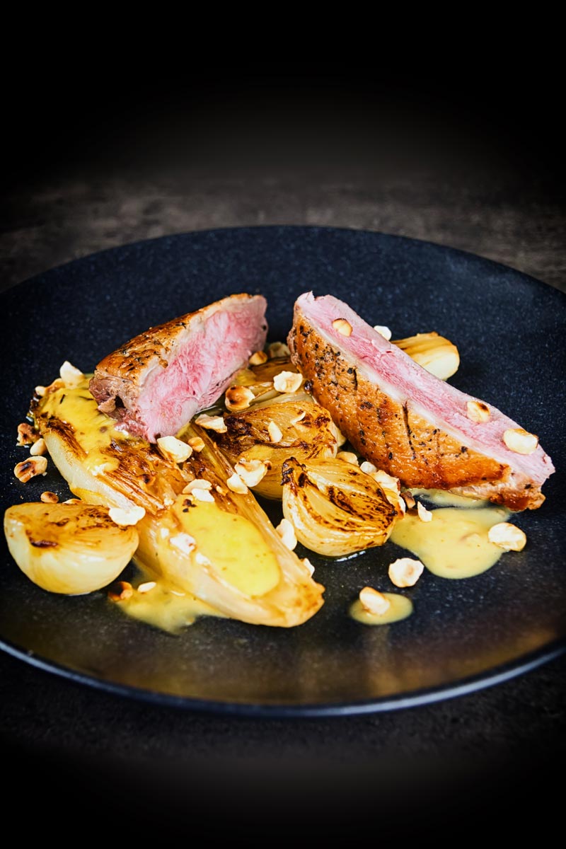 Endive may not be the first on the list of many peoples favourite vegetables, but it should be and it is perfect alongside this pan fried duck breast that utilises the cold pan method and is bundled a sexy anchovy sauce and it take less than an hour from start to finish. #endivesbraises #duckbreastrecipes #duckmaincourse #hazelnutsrecipes