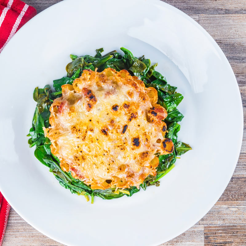 Yes, I know it is not really a pie, but hey it is my rigatoni pasta pie… Rigatoni standing to attention with a balsamic tomato sauce, mozzarella and Parmesan and wilted spinach!