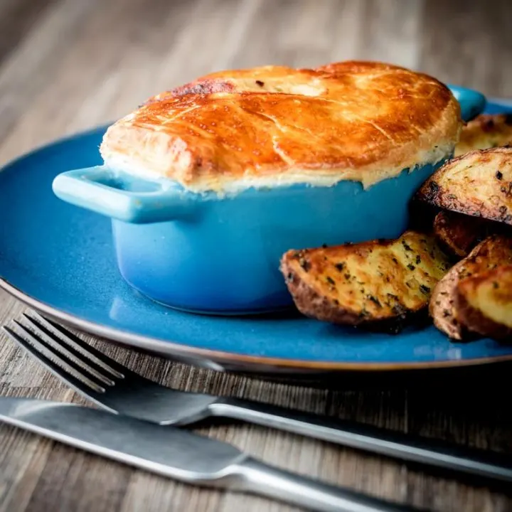 This easy Chicken and Mushroom Pie recipe is an all-time classic British pie, this one takes the pot pie approach using shop bought puff pastry for a quick and simple midweek dinner.