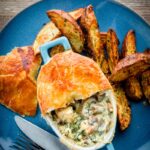 This easy Chicken and Mushroom Pie recipe is an all-time classic British pie, this one takes the pot pie approach using shop bought puff pastry for a quick and simple midweek dinner.
