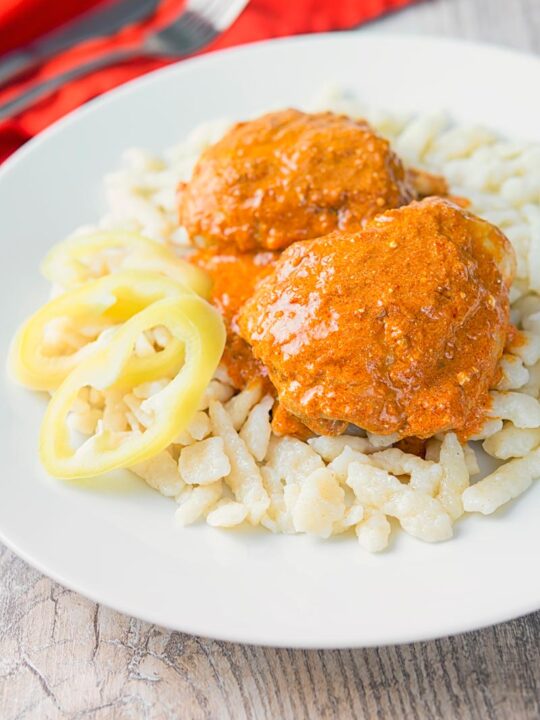 Hungarian Chicken Paprikash with Homemade Nokedli, moist chicken thighs in a velvety sweet paprika rich sauce served with fresh nokedli or dumplings