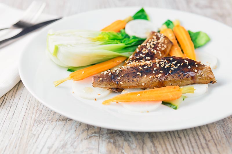 Asian influenced smoked mackerel salad with a teriyaki glazed smoked mackerel fillet, pickled carrots, radish, cucumber and blanched bok choi.