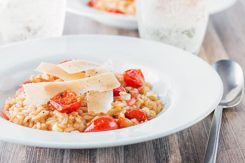 Tomatoes are a main stay of Italian food but a tomato risotto remains something of an unusual dish but a real favourite of mine! It’s a perfect vegetarian week night meal… ready in less than an hour!
