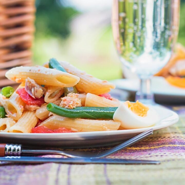 The classic(ish) flavours of Nicoise feature in this tuna pasta salad that is perfect for packing up in a picnic basket and eating in the sun!