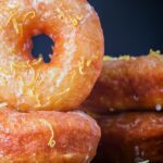 Portrait Image of lemon glazed ring donuts cooked from a basic donut recipe