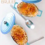 Tall image of two individual instant pot rice pudding taken from above cooked in blue serving pots with a brulee topping with text