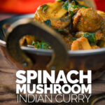 Close up portrait image of a spinach and mushroom curry served in a copper bowl on a rustic wooden table with red linen and a vintage fork with text