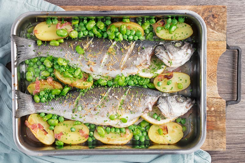 Whole Baked Sea Bass with Potatoes & Broad Beans Krumpli