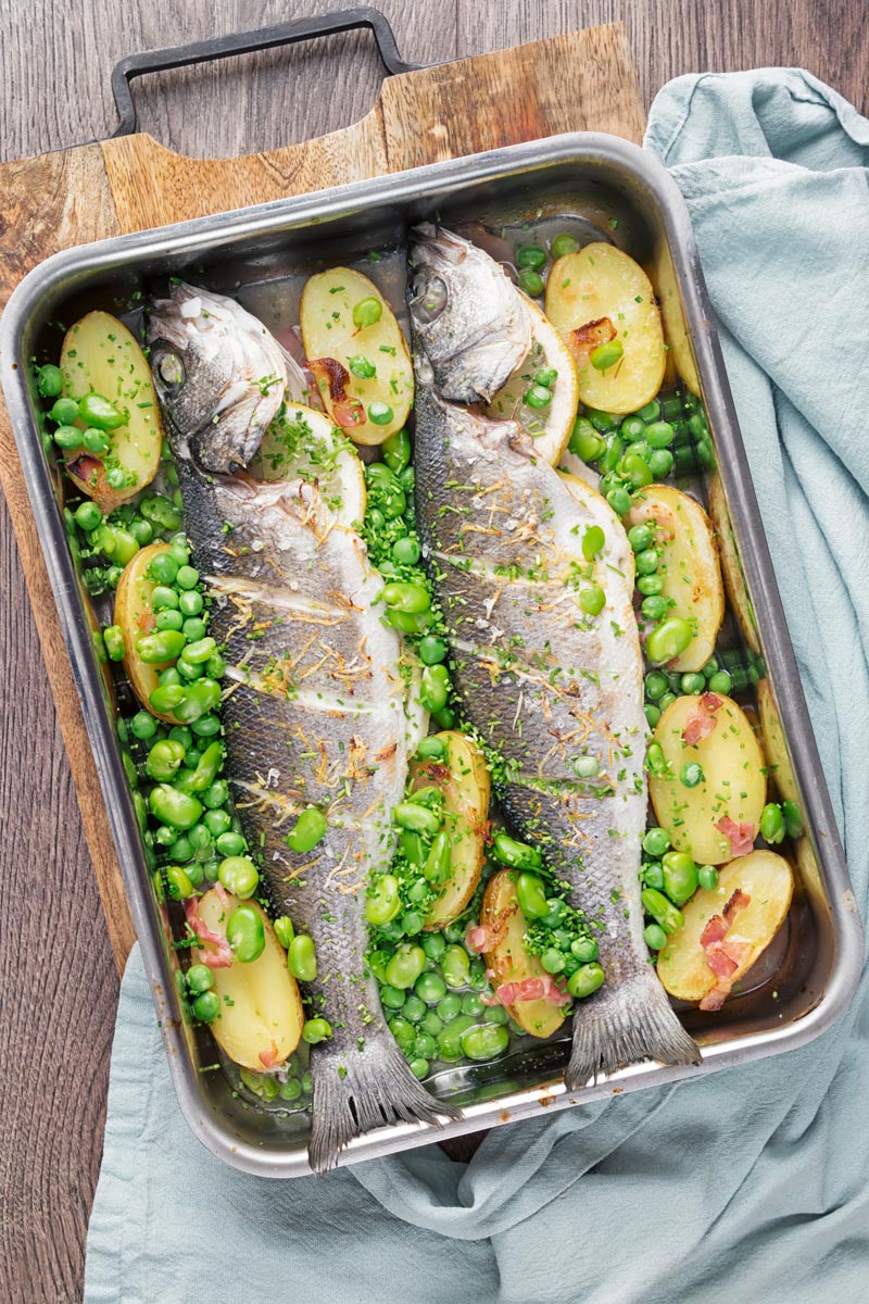 Whole Baked Sea Bass with Potatoes, Broad Beans and Peas | Krumpli
