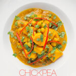 Portrait overhead picture of a golden chickpea and sweet potato curry with a white bowl with chopped coriander and shredded chilli with text