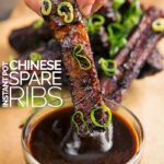 Portrait image of sticky Chinese spare ribs being dipped into a sauce with text overlay