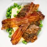 Portrait overhead image of bacon liver an onions with mash and peas served in a white bowl with text overlay