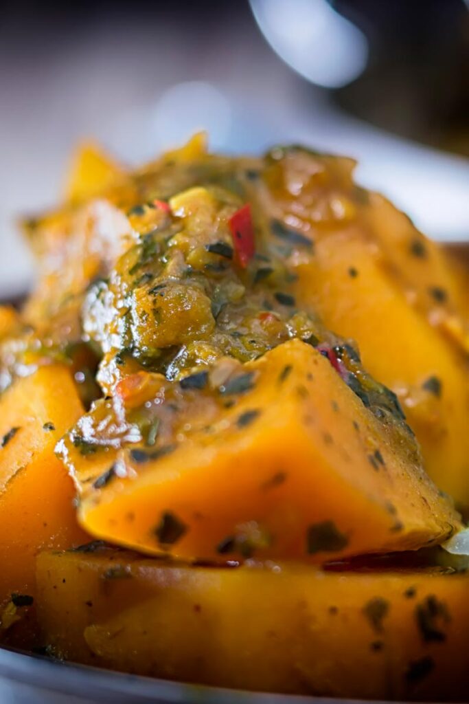 Portrait close up image of a steaming hot pumpkin curry