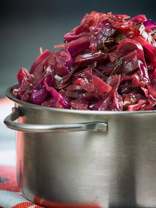 Portrait close up image of braised red cabbage served in a small aluminium pan