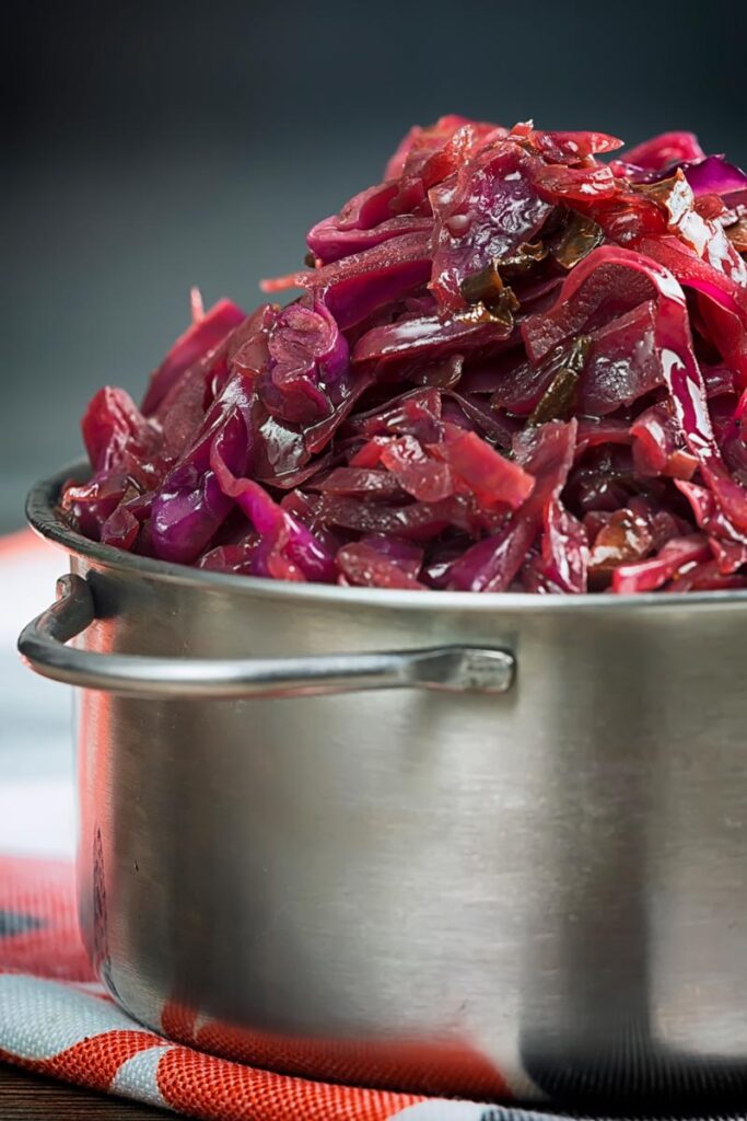 Portrait close up image of braised red cabbage served in a small aluminium pan
