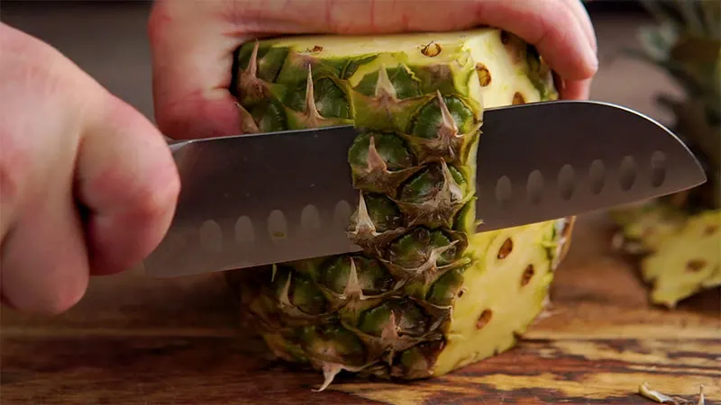Step 3 in how to prepare a pineapple remove skin