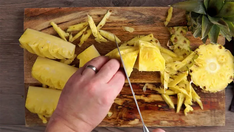 Optional Step 7 in how to prepare a pineapple, cut into 8 wedges