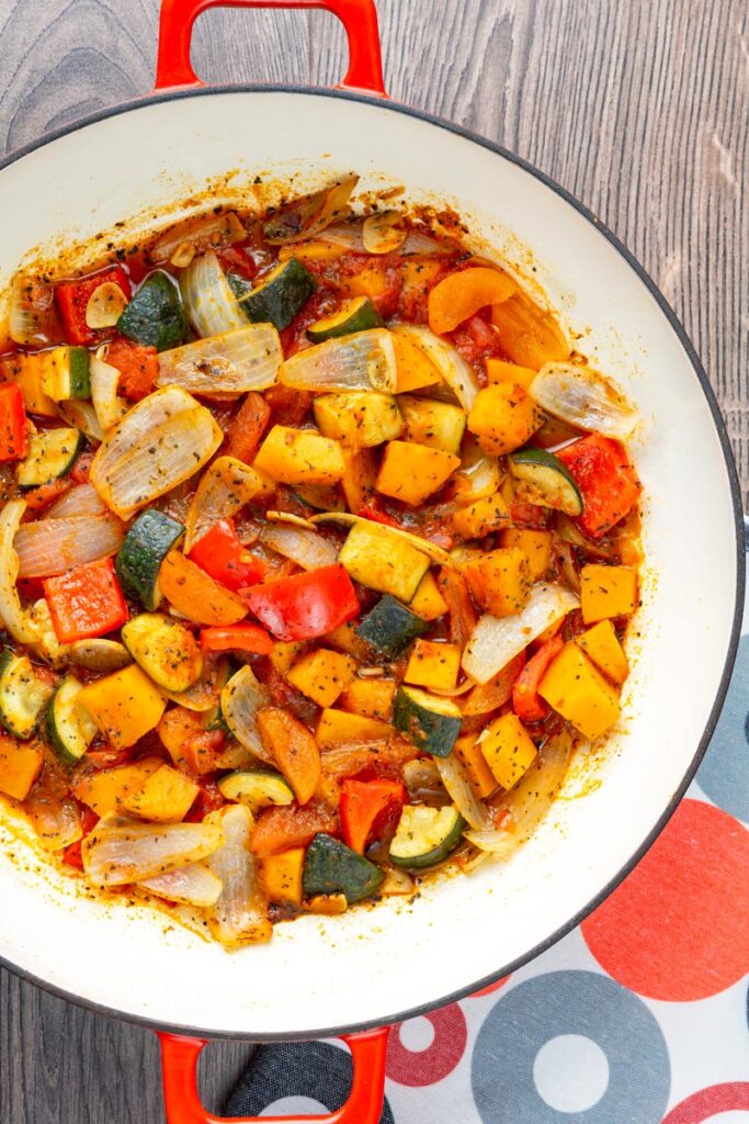 Portrait overhead image of a vegetable tagine served in a pan