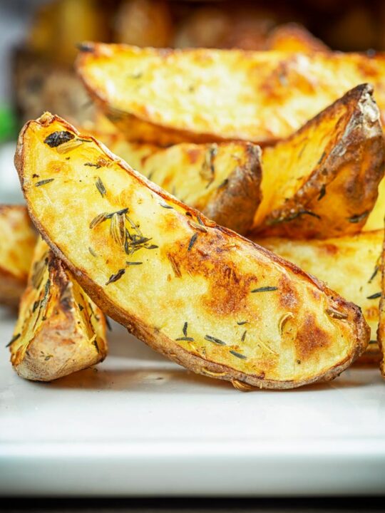 Close-up image of air fryer cooked potato wedges