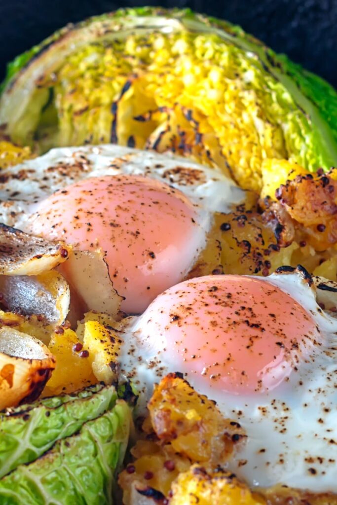 Portrait close up image of a cabbage and potato bake with eggs