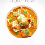 Portrait overhead image of murgh makhani or a butter chicken curry with a swirl of cream and fresh coriander served in a white bowl with text overlay