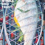Portrait image of a whole trout being cooked on a BBQ in a fish basket with text overlay