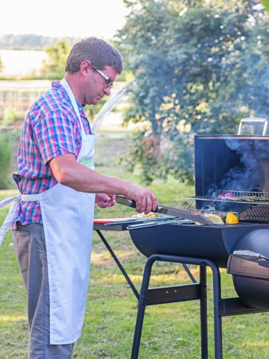 A man cooking on a BBQ