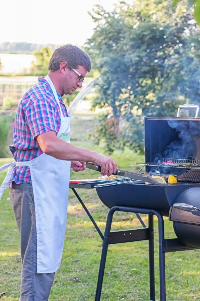 A man cooking on a BBQ