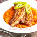 Portrait image of roast pork belly slices served on a Hungarian lecso served in a white bowl with text overlay