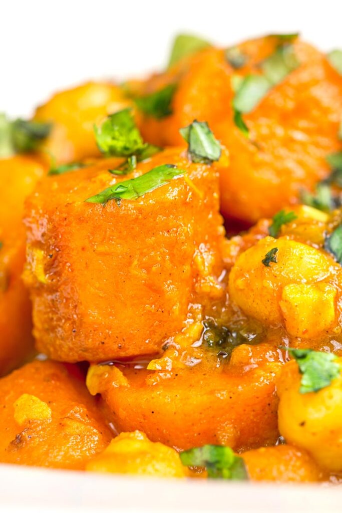 Portrait close up image of a chickpea and carrot curry