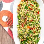 Portrait over head image of a herby tabbouleh salad served in a white bowl