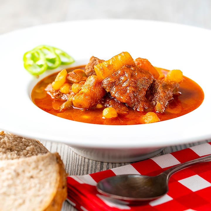 Square image of a Traditional Hungarian beef goulash or gulyasleves with handmade csipetke (pasta)