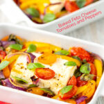 Portrait image of Mediterranean baked feta cheese with tomatoes and peppers served in a white gratin bowl with text overlay