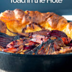 Portrait close up image of a roasted vegetable toad in the hole cooked and served in a cast iron pan with text overlay