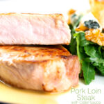 Portrait close up image of a pork loin steak sliced to show the moist interior with text overlay