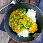 Portrait overhead image of a takeaway influenced Chinese chicken curry with garden peas and spring onions featuring a text overlay