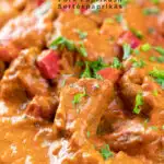 Portrait close up image of a Hungarian inspired pork paprikash or sertéspaprikás served with nokedli on a grey plate featuring a title overlay