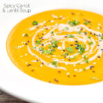 Portrait image of a spicy carrot and lentil soup spiced with harissa paste and garnished with a swirl of tahini served in a white bowl featuring a title overlay