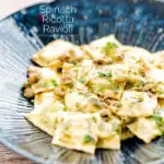Portrait image of homemade spinach and ricotta ravioli with a lemon caper butter sauce featuring a title overlay