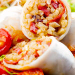 Portrait close up image of brown rice stuffed squid on a tomato sauce featuring a title overlay