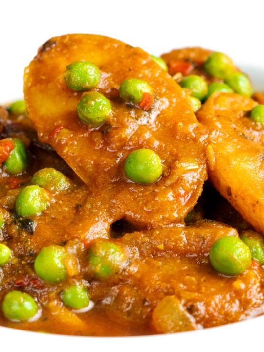 Close up of an Indian aloo matar, pea and potato curry