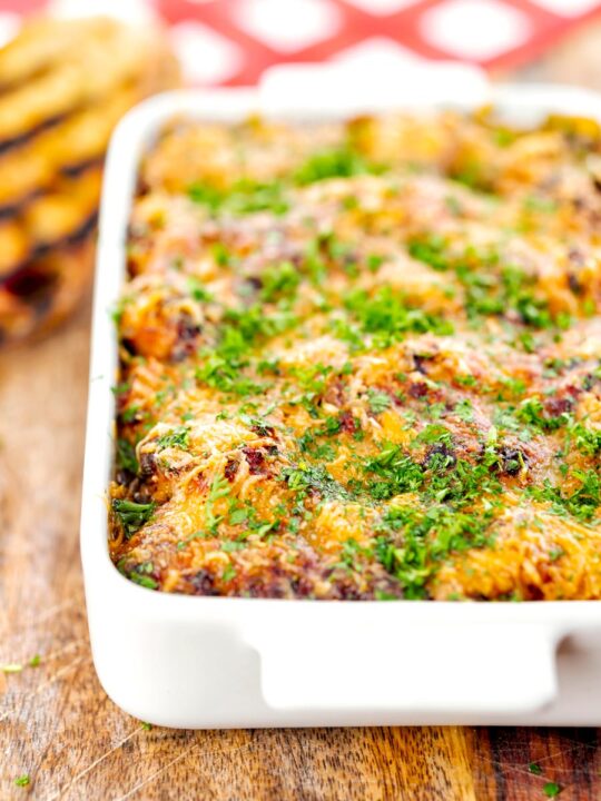 Portrait close up image of gnocchi alla Sorrentina served in a gratin dish with griddled bread