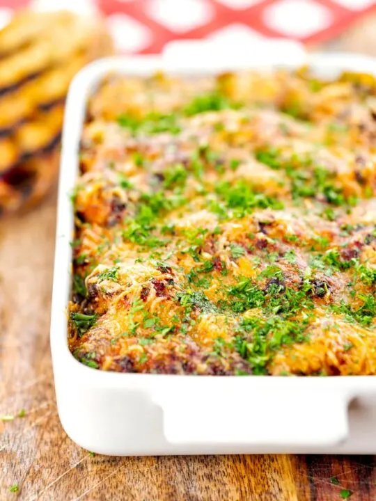 Portrait close up image of gnocchi alla Sorrentina served in a gratin dish with griddled bread