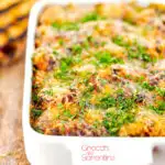 Portrait close up image of gnocchi alla Sorrentina served in a gratin dish with griddled bread featuring a title overlay