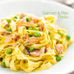 Portrait image of salmon and pea pasta with tagliatelle pasta and crispy salmon skin and snipped chives featuring a title overlay