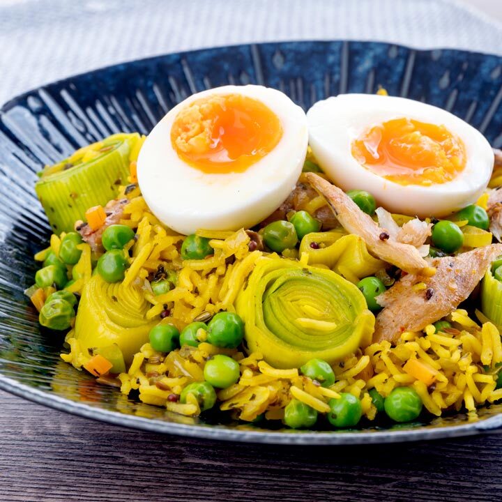 Square image of an Indian inspired smoked mackerel kedgeree with boiled eggs and leeks